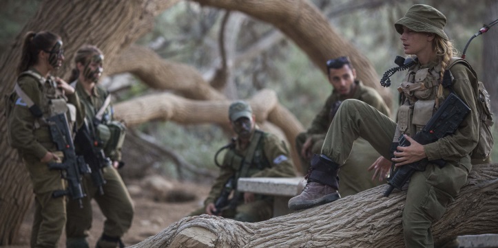 Soldiers of the Caracal Battalion seen resting before beginning a 16 Kilometer journey overnight to complete their training course, in Azoz village, southern Israel, near the border with Egypt, September 3, 2014. Formed in 2004, the Caracal Battalion is an infantry combat battalion of the Israel Defense Forces, composed of both male and female soldiers, which is stationed along the Egyptian border. Most of the Caracal soldiers are female. Photo by Hadas Parush/Flash90 *** Local Caption *** ????
????
????
??? ?????
?????
????
?????
??????
??????
???? ?????
??? ?????
??"?
?????
??????